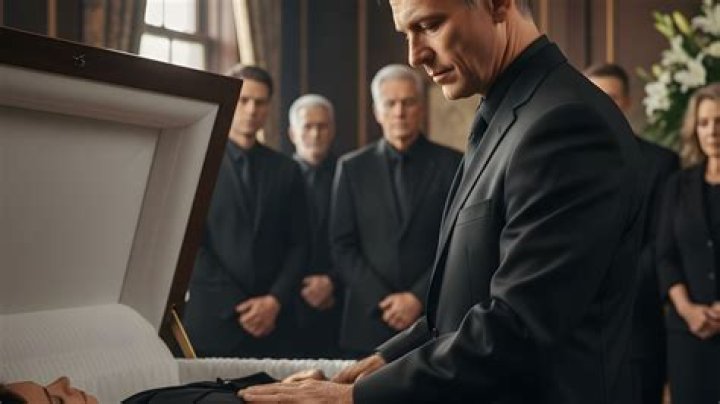 Is it okay to touch a body at a funeral?